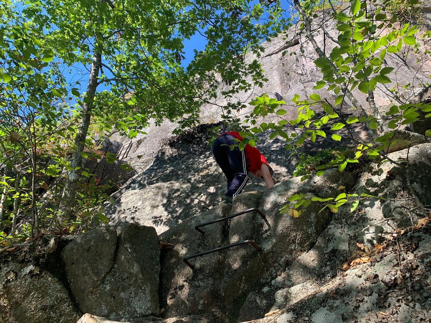 A son climbing part of Precipice Trail
