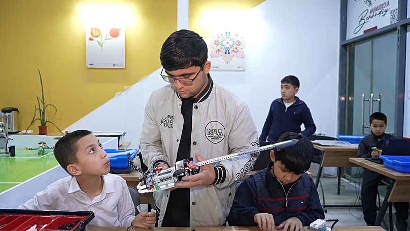 Navruzbek Shaydullayev teaches his students how to build and program robots
