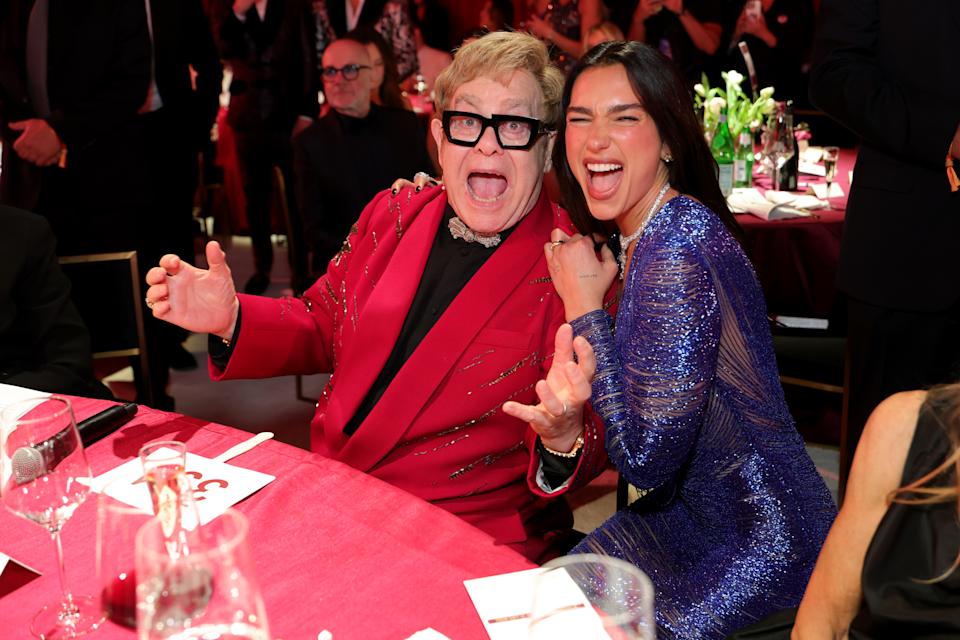 WEST HOLLYWOOD, CALIFORNIA - MARCH 15: (Exclusive Coverage) (L-R) Elton John and Dua Lipa attend Elton John AIDS Foundation's 34th Annual Academy Awards Viewing Party on March 15, 2026 in West Hollywood, California. (Photo by Kevin Mazur/Getty Images for Elton John AIDS Foundation)