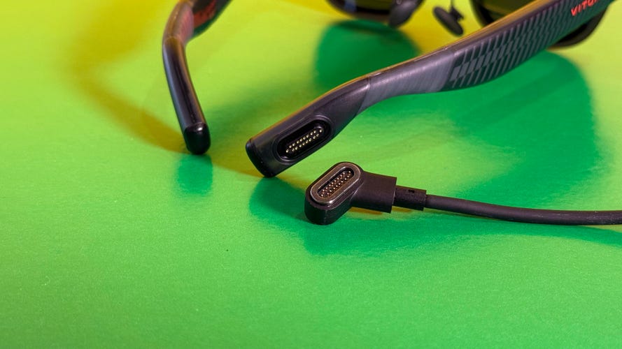 Magnetic pin-based cable shown next to Luma Pro glasses