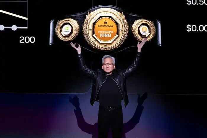 Jensen Huang gestures under an image of a belt during his 2026 GTC keynote