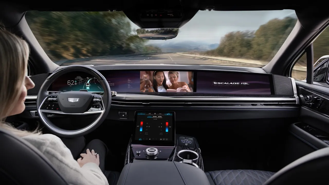 person sitting behind steering wheel of SUV 