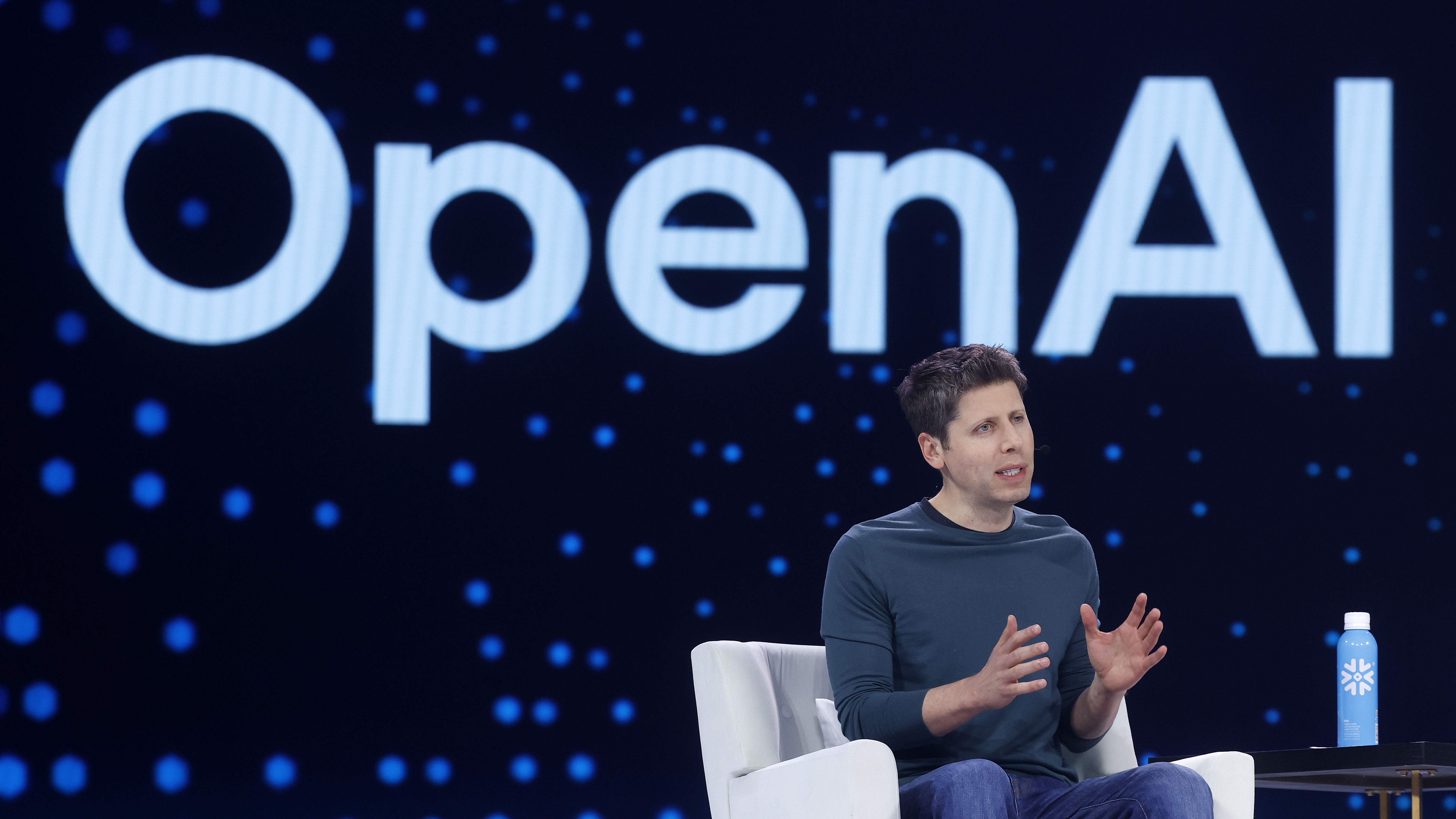 Sam Altman on a chair