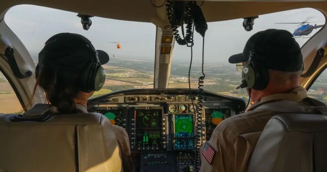 pilot and student in helicopter